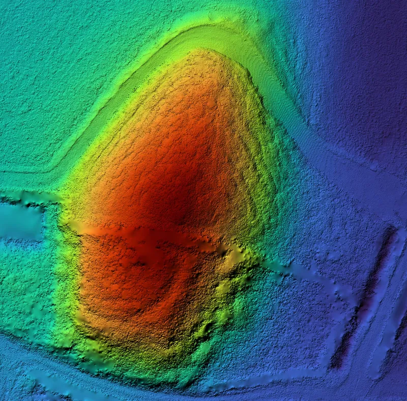 LiDAR terrain model of an earth mound with the trees removed, coloured by height.